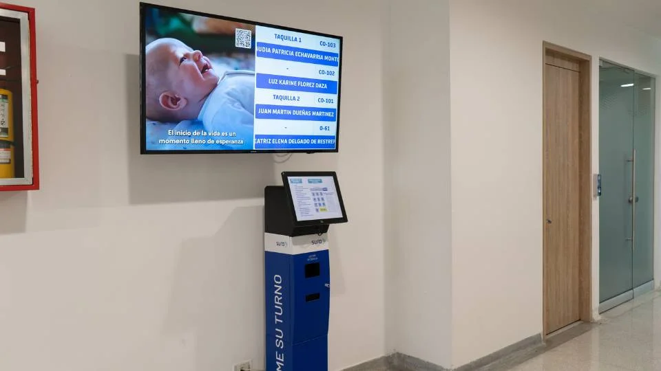 Comprehensive service point with interactive floor dispenser and hanging monitor for user guidance